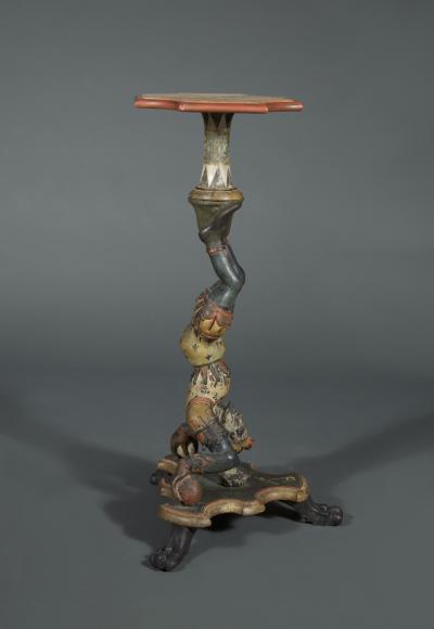 AN INTERESTING PAIR OF CARVED AND POLYCHROME PAINTED STANDS