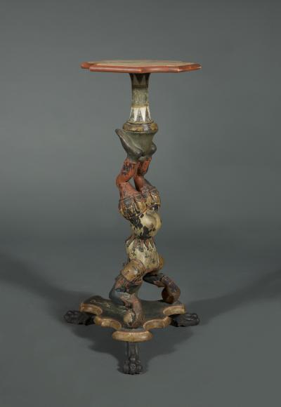 AN INTERESTING PAIR OF CARVED AND POLYCHROME PAINTED STANDS
