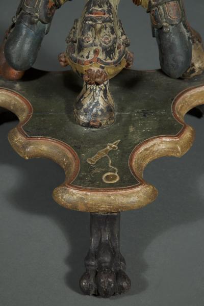 AN INTERESTING PAIR OF CARVED AND POLYCHROME PAINTED STANDS