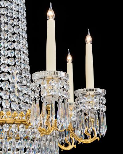 AN ORMOLU MOUNTED EIGHT LIGHT REGENCY CHANDELIER