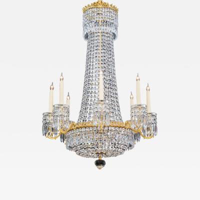 AN ORMOLU MOUNTED EIGHT LIGHT REGENCY CHANDELIER