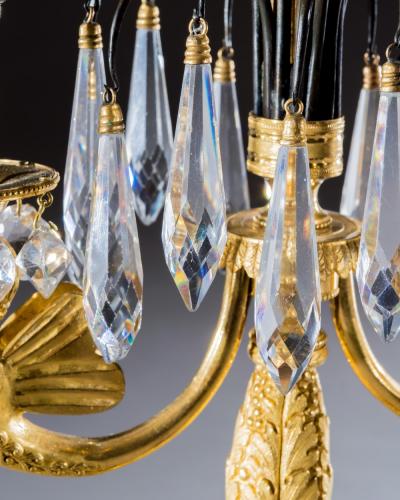 AN ORNATE PAIR OF ORMOLU AND BRONZE REGENCY CANDELABRA