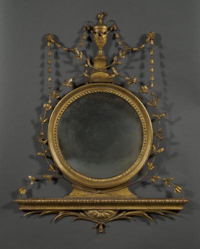 AN UNUSUAL GEORGE III GILTWOOD AND COMPOSITION CONVEX MIRROR