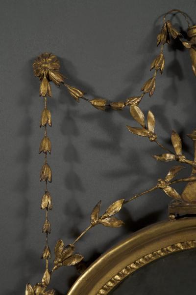 AN UNUSUAL GEORGE III GILTWOOD AND COMPOSITION CONVEX MIRROR