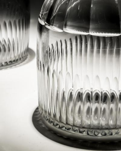 AN UNUSUAL PAIR OF FOUR RING GEORGIAN SLICE FLUTE DECANTERS