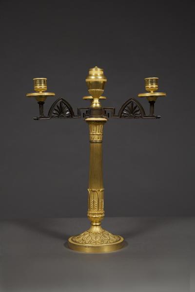 AN UNUSUAL PAIR OF GILT AND PATINATED BRONZE FOUR LIGHT NEOCLASSICAL CANDELABRA