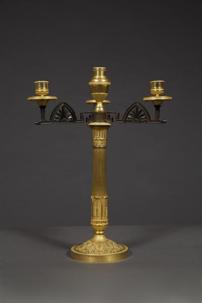 AN UNUSUAL PAIR OF GILT AND PATINATED BRONZE FOUR LIGHT NEOCLASSICAL CANDELABRA