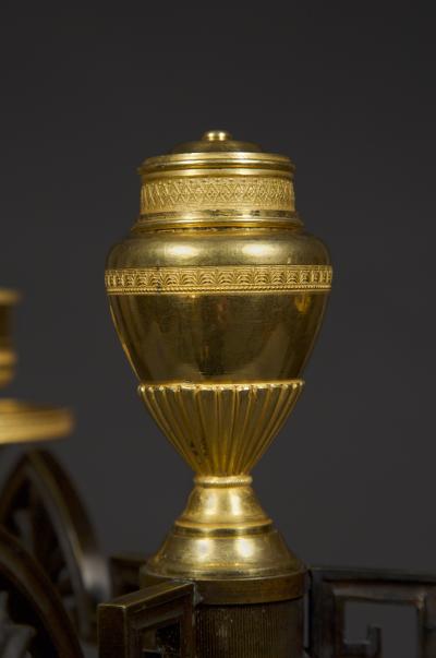 AN UNUSUAL PAIR OF GILT AND PATINATED BRONZE FOUR LIGHT NEOCLASSICAL CANDELABRA