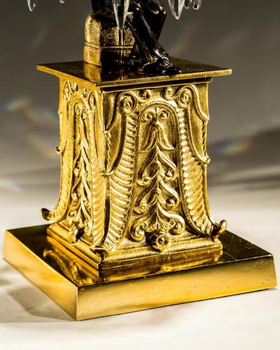 AN UNUSUAL PAIR OF GILT BRONZE MILITARY FIGURE CANDLESTICKS