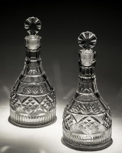 AN UNUSUAL PAIR OF IRISH CUT GLASS DECANTERS