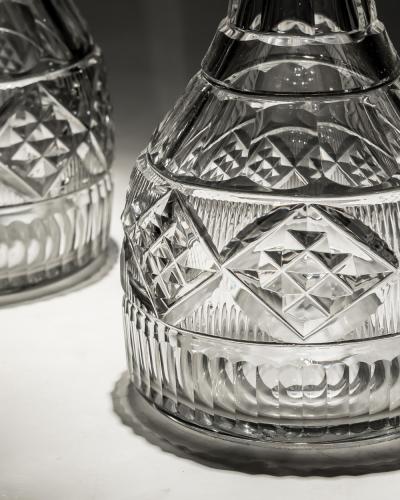 AN UNUSUAL PAIR OF IRISH CUT GLASS DECANTERS