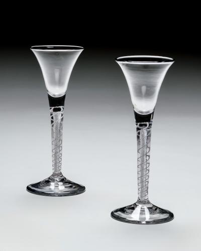 AN UNUSUAL PAIR OF MIXED TWIST WINE GLASSES