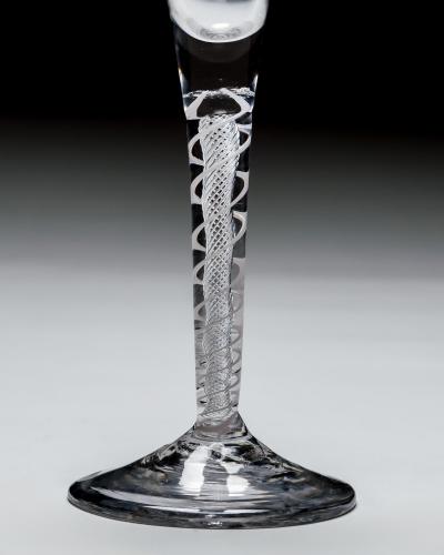 AN UNUSUAL PAIR OF MIXED TWIST WINE GLASSES