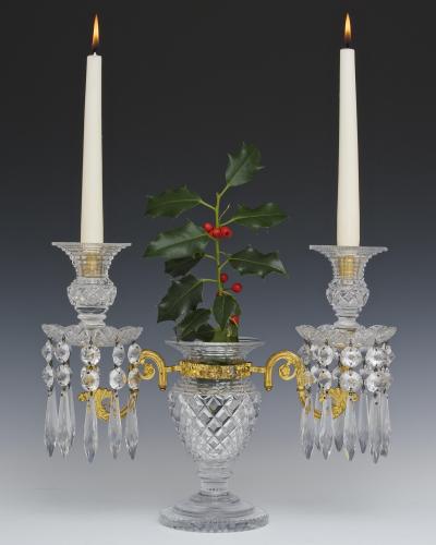 AN UNUSUAL PAIR OF REGENCY ORMOLU MOUNTED CUT GLASS CANDELABRA