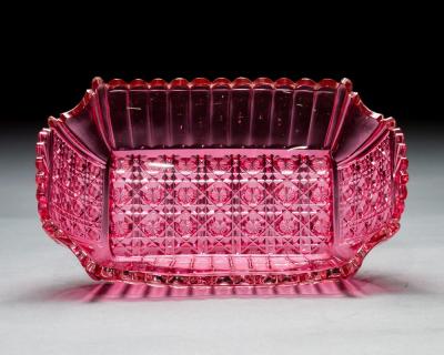 AN UNUSUAL RECTANGULAR RICHLY CUT PINK FRUIT BOWL