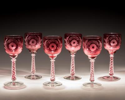 AN UNUSUAL SET OF SIX COLOUR TWIST JACOBITE GLASSES