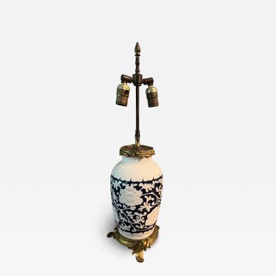 ANTIQUE CHINESE BLACK AND WHITE FLORAL CERAMIC LAMP WITH BRONZE MOUNTS