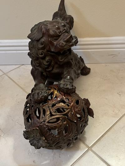 ANTIQUE PATINATED IRON FOO DOG WITH GILT BALL WITH FLOWERS SCULPTURE