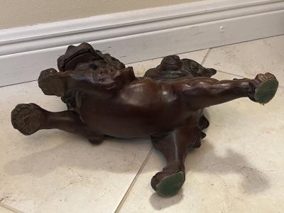 ANTIQUE PATINATED IRON FOO DOG WITH GILT BALL WITH FLOWERS SCULPTURE