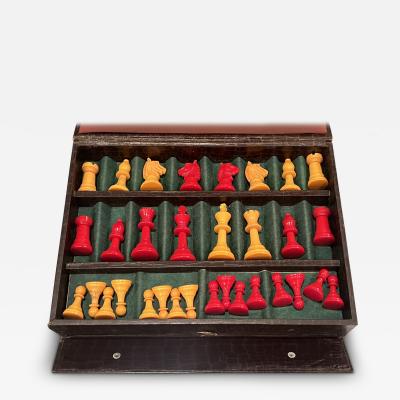 ART DECO ERA RED AND YELLOW BAKELITE CHESS SET WITH BOARD IN MOCK ALLIGATOR CASE