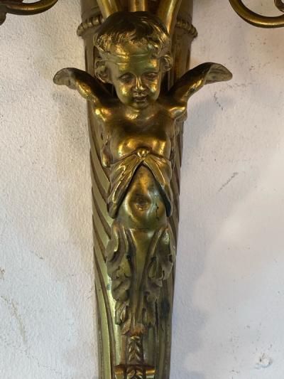 ART NOUVEAU FRENCH BRONZE CUPID SCONCE WITH THREE FANCY GLASS FLOWER SHADES