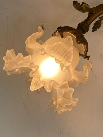 ART NOUVEAU FRENCH BRONZE CUPID SCONCE WITH THREE FANCY GLASS FLOWER SHADES