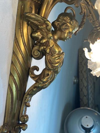 ART NOUVEAU FRENCH BRONZE CUPID SCONCE WITH THREE FANCY GLASS FLOWER SHADES