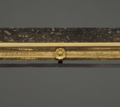 Adam Weisweiler AN EXQUISITE STEEL AND GILT BRONZE CENTER TABLE WITH FOSSIL MARBLE TOP