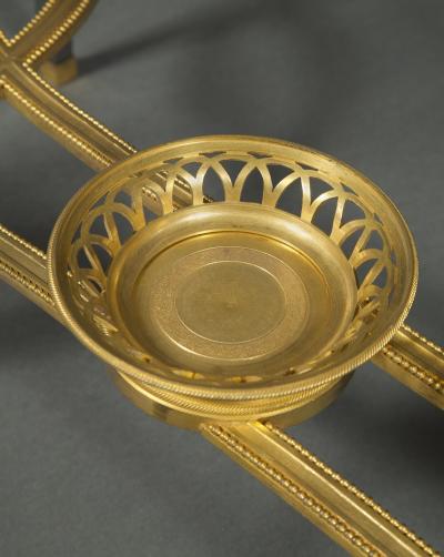 Adam Weisweiler AN EXQUISITE STEEL AND GILT BRONZE CENTER TABLE WITH FOSSIL MARBLE TOP