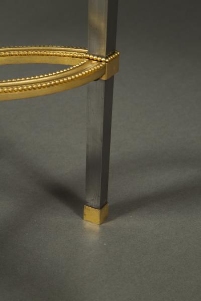 Adam Weisweiler AN EXQUISITE STEEL AND GILT BRONZE CENTER TABLE WITH FOSSIL MARBLE TOP