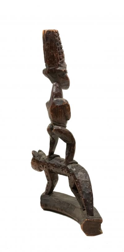 African Sculpture of a Figure Standing on a Leopard