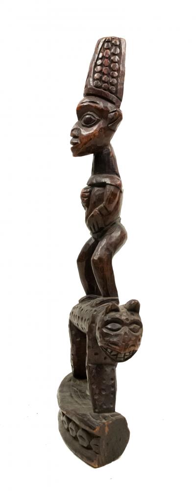African Sculpture of a Figure Standing on a Leopard
