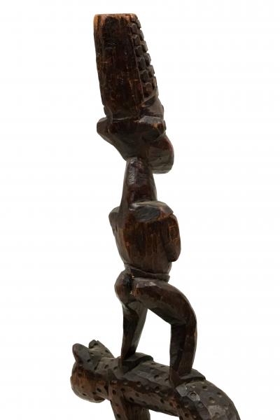 African Sculpture of a Figure Standing on a Leopard