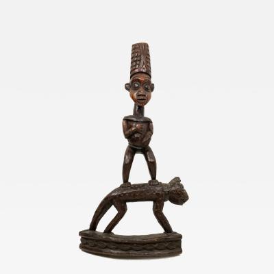 African Sculpture of a Figure Standing on a Leopard