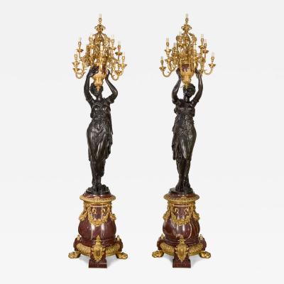 Albert Ernest Carrier Belleuse Monumental Pair of Rouge Marble Gilt and Patinated Bronze Figural Torch res
