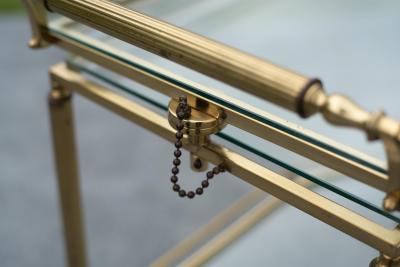 Aldo Tura Italian Hollywood Regency Brass and Glass Three Tier Pivoting or Swivel Bar Cart