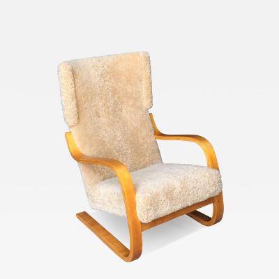 Alvar Aalto Alvar Aalto Armchair Model 401 in Birch and Honey Sheepskin Artek 1950s