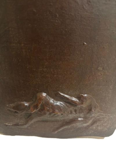 American Mid Century bronze wall plaque of a reclining dog by Leonard Baskin