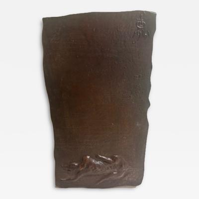 American Mid Century bronze wall plaque of a reclining dog by Leonard Baskin