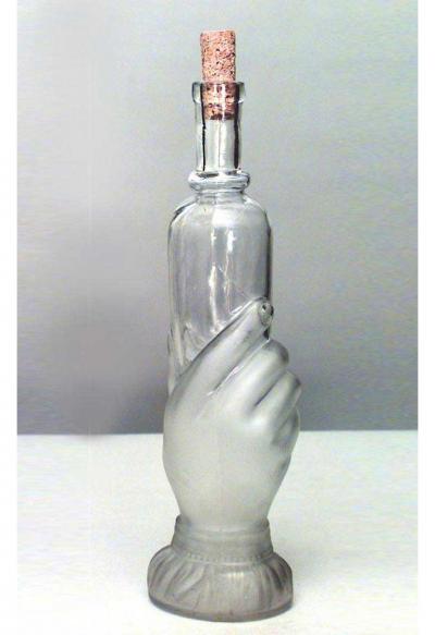 American Victorian glass decanter of hand holding small bottle