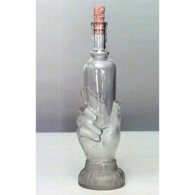 American Victorian glass decanter of hand holding small bottle