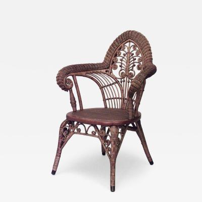 American Victorian natural wicker arm chair with woven roll arms