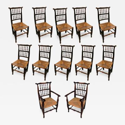 An 18th Century English Elmwood Set of Ten Side and Two Arm Spindle Back Chairs