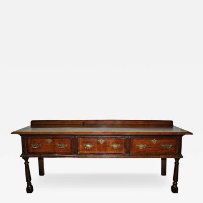 An 18th Century English Queen Anne Ashwood Sideboard