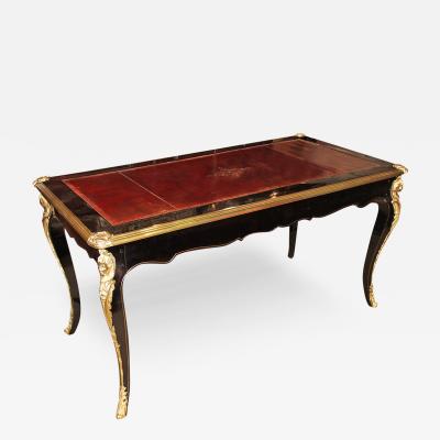 An 18th Century French Louis XV Ebonized and Ormolu Console