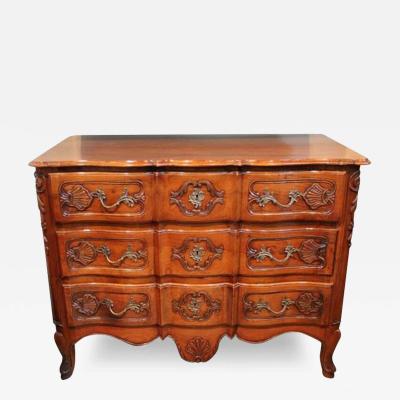 An 18th Century French Louis XV Serpentine Front Three Drawer Walnut Commode