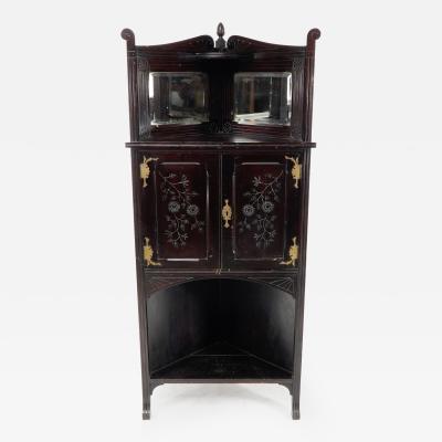 An Aesthetic Movement Mahogany Corner Cabinet with Incised Floral Decoration