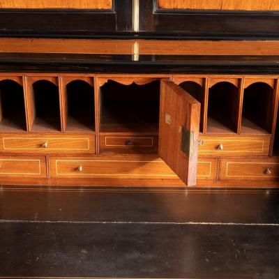 An Anglo Chinese camphor and ebony campaign secretaire bookcase