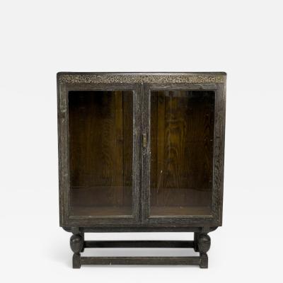 An Art Deco Dark Limed Oak Glazed Bookcase with Carved Floral Decoration
