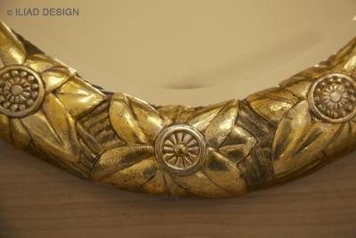 An Art Deco Inspired Gilt and Ebonized Oval Mirror by ILIAD Design